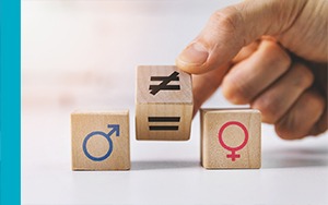 Graphic showing symbols of male and female with that of equality and inequality in between